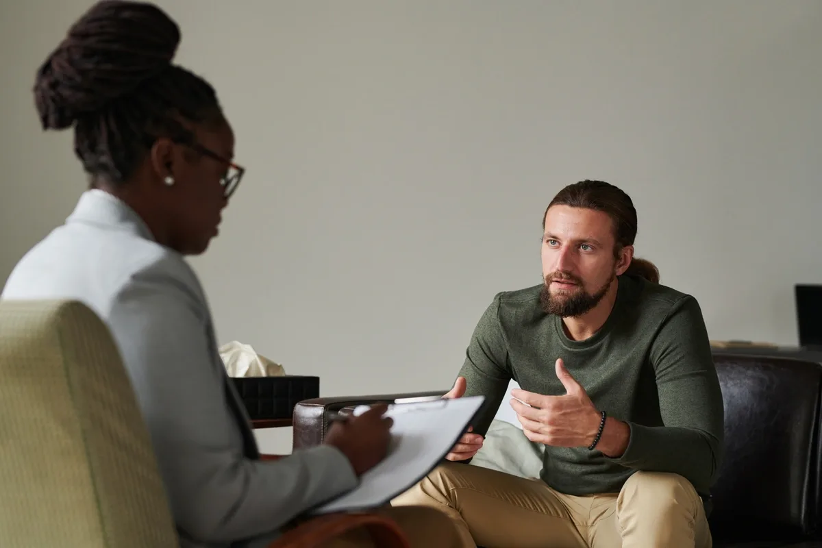 MAT: Man discussing MAT options with female psychiatrist