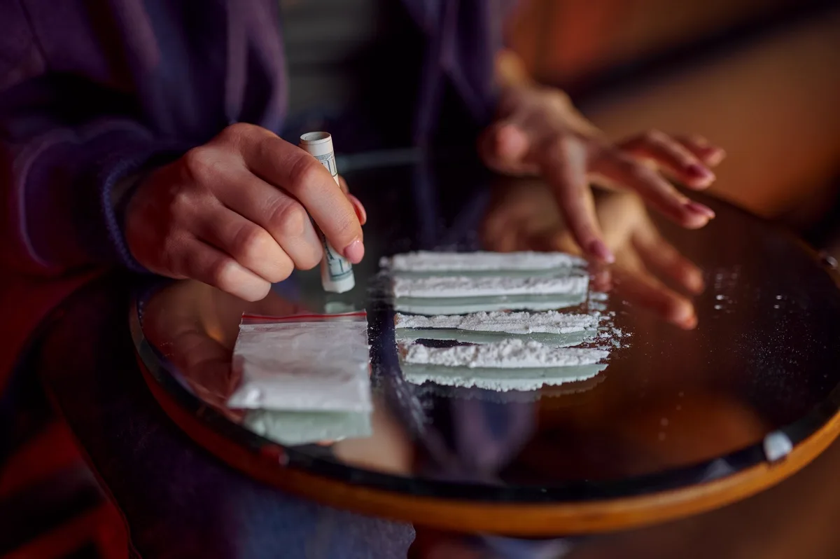 Cocaine Addiction: Lines of powder on a mirror