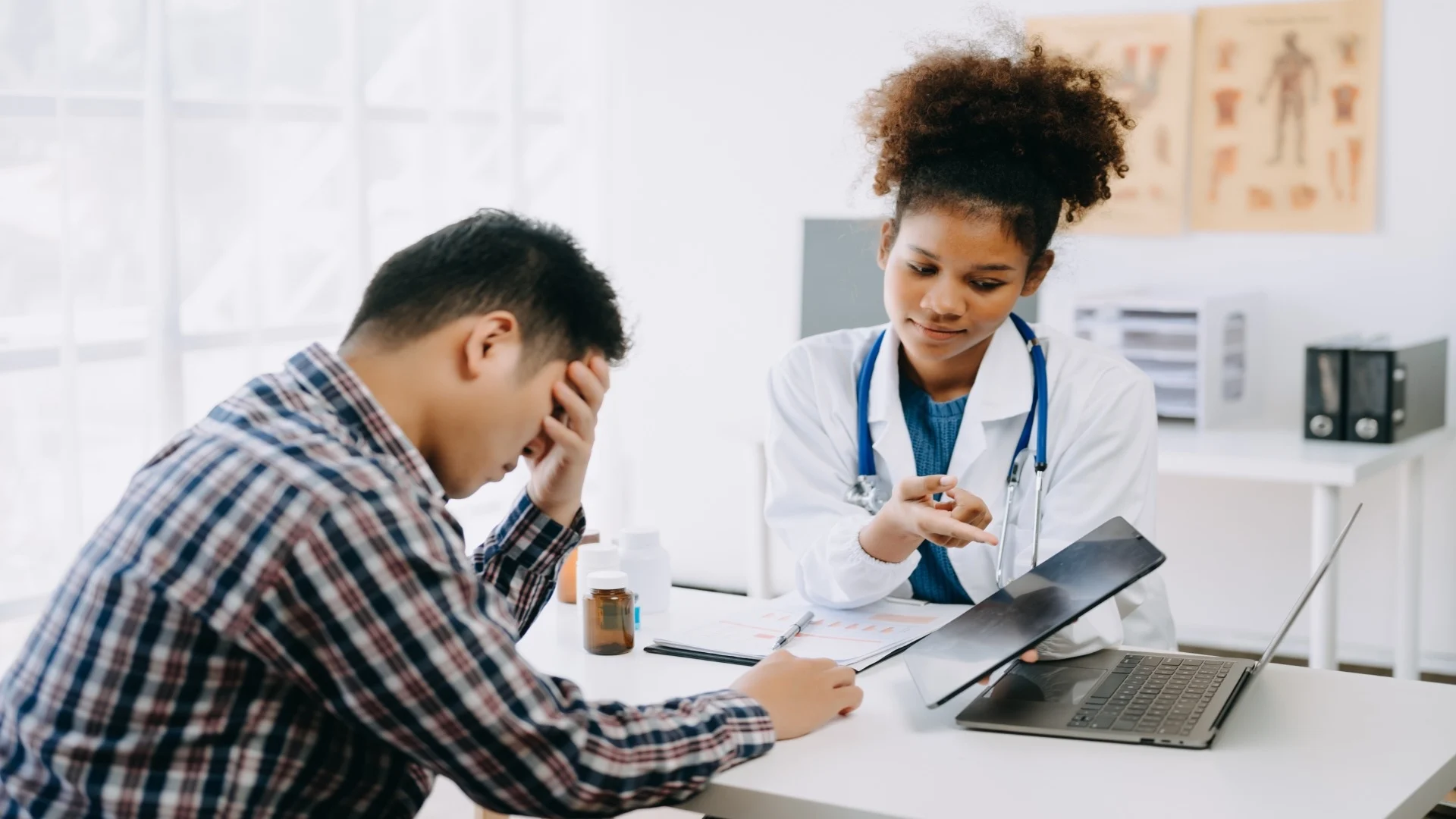 the-african-doctor-holds-the-patient-s-hand-healt-2024-11-01-19-25-42-utc