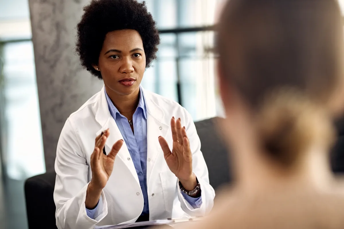 Drug Rehab: Doctor speaking to a patient