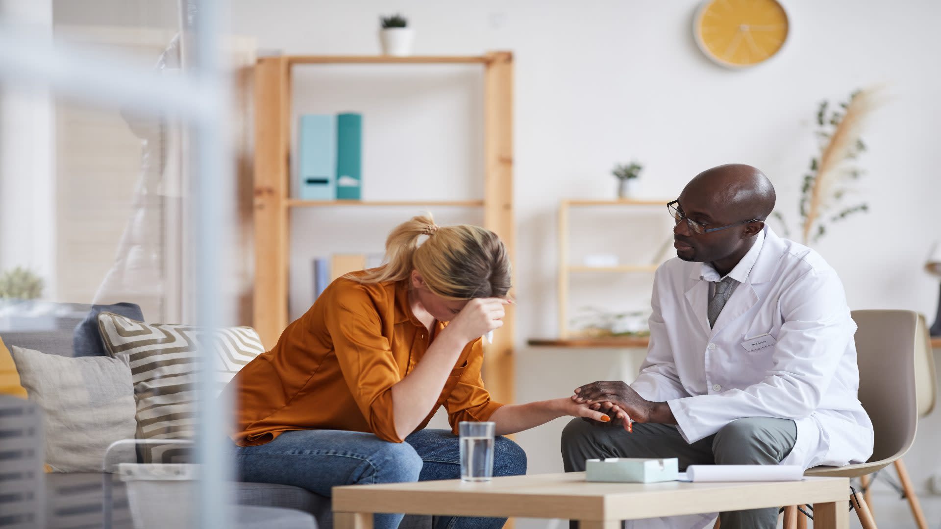 Therapist comforting a woman during a mental health session—exploring questions like how long does depression last and what treatment options are available