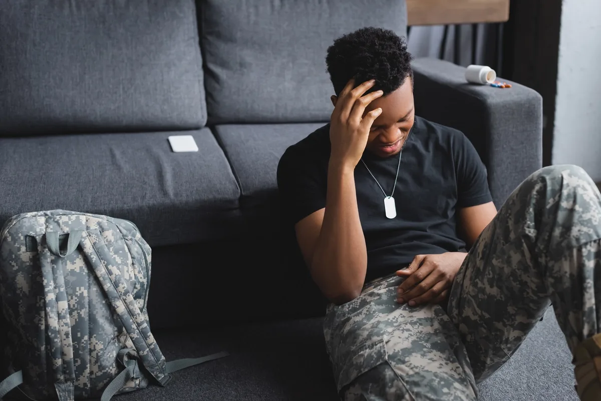 Man with PTSD Crying on the Floor
