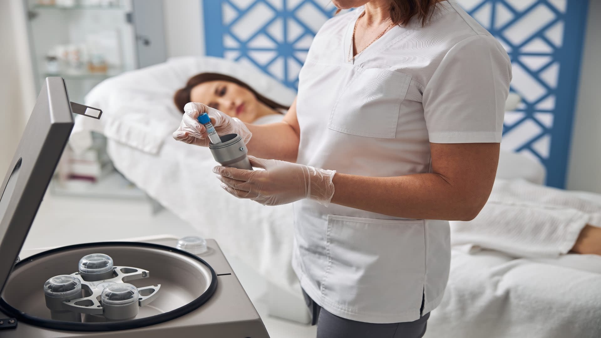 female-doctor-placing-test-tube-into-metal-contain-2025-03-09-08-02-03-utc