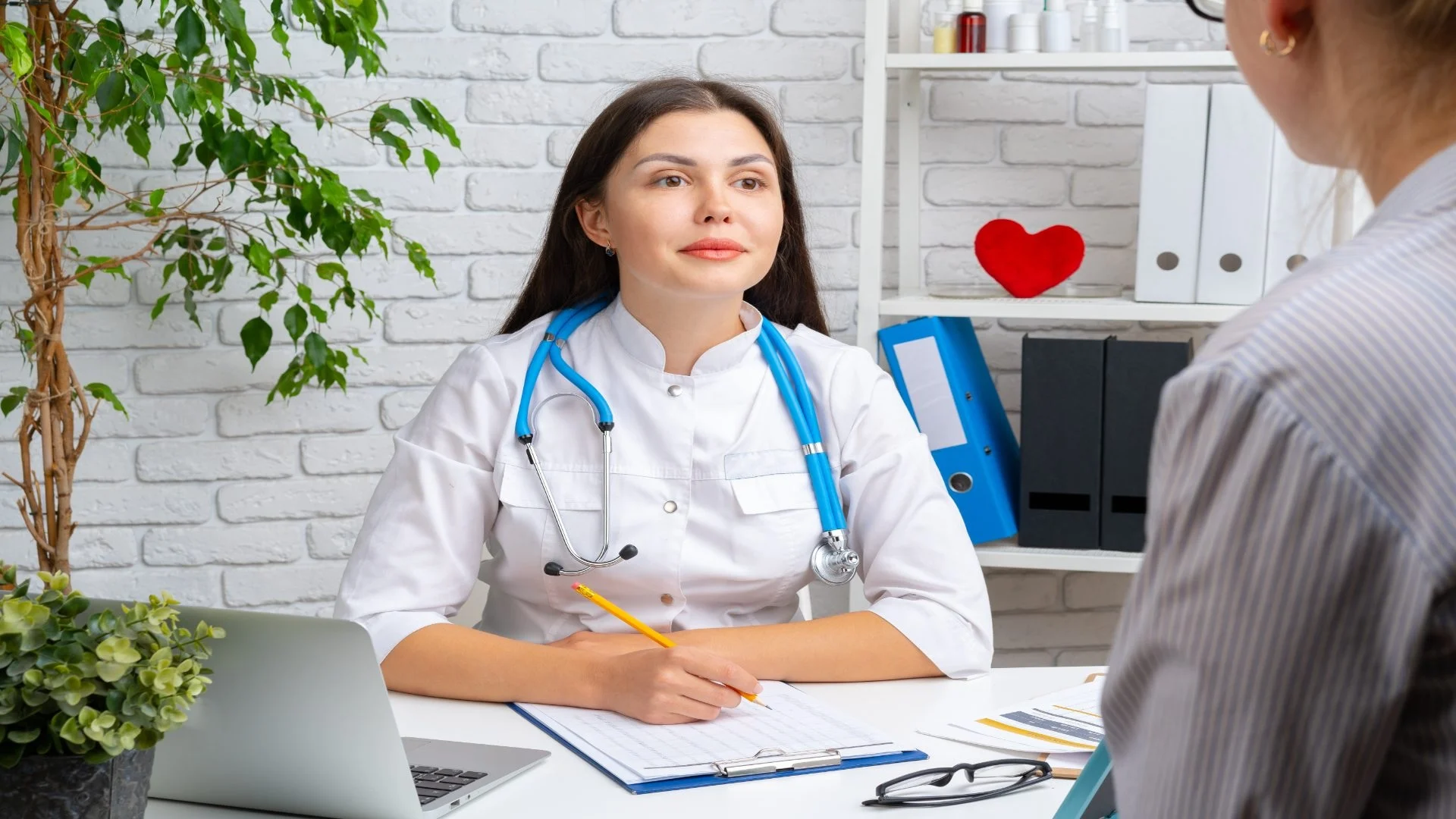 young-nice-woman-doctor-having-a-conversation-with-2025-02-25-01-44-58-utc