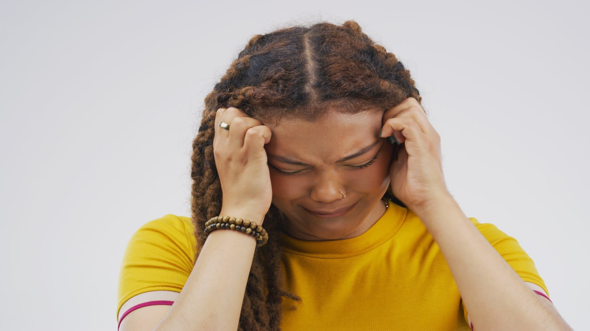 studio-shot-of-a-young-woman-crying-while-standing-2023-11-27-05-37-18-utc
