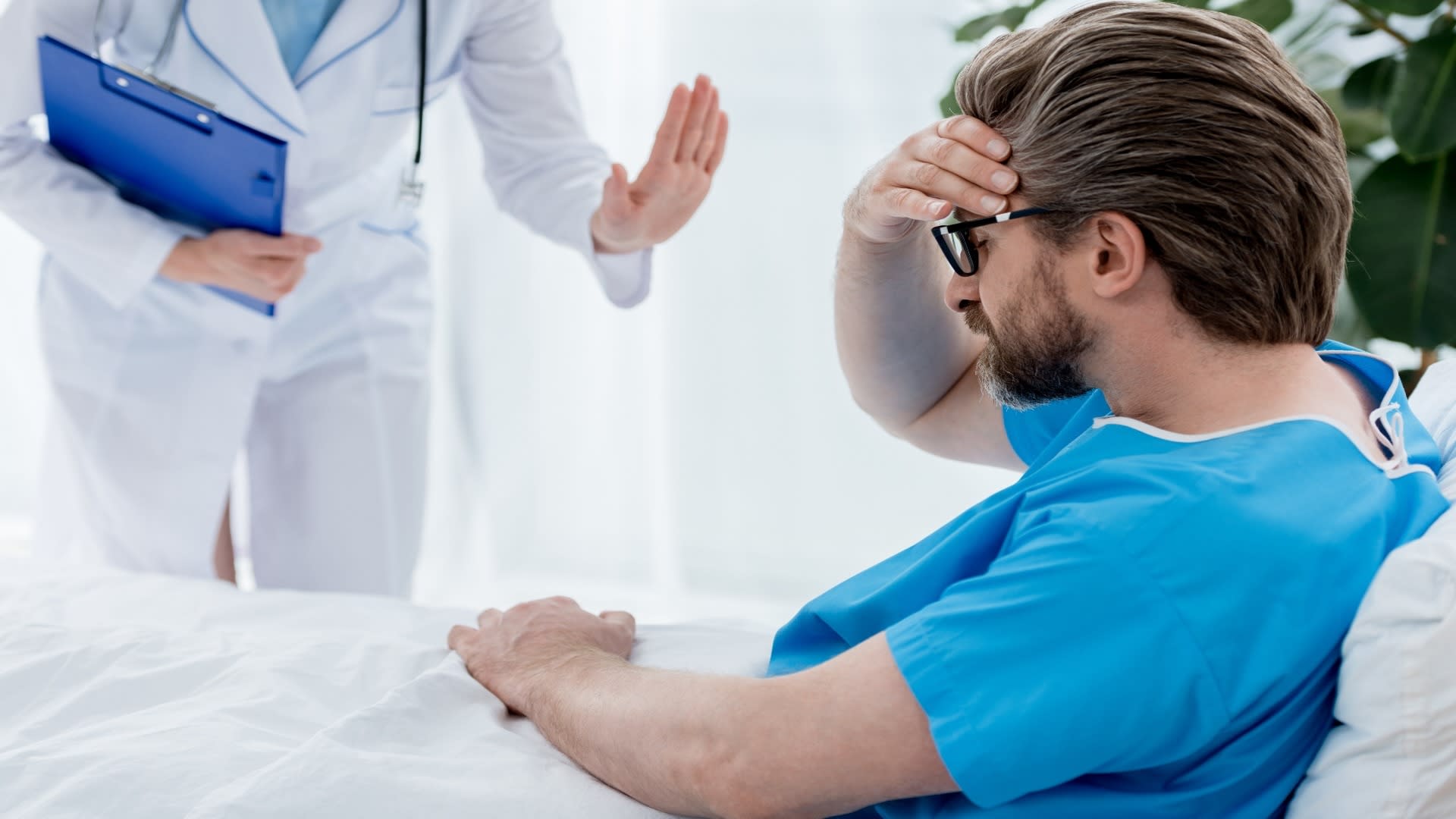 cropped-view-of-doctor-in-white-coat-calming-down-2024-11-17-15-04-43-utc