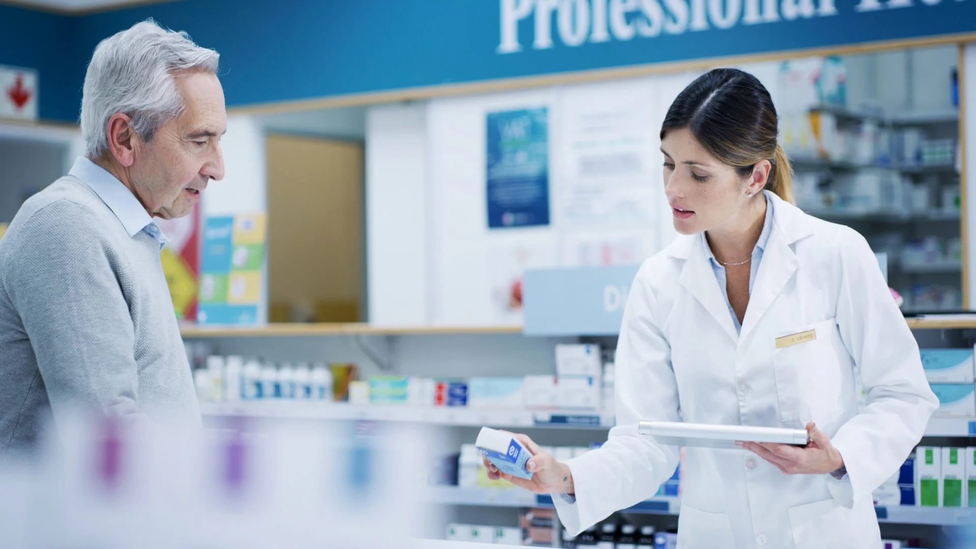 pharmacist giving patient Prednisone and checking the label