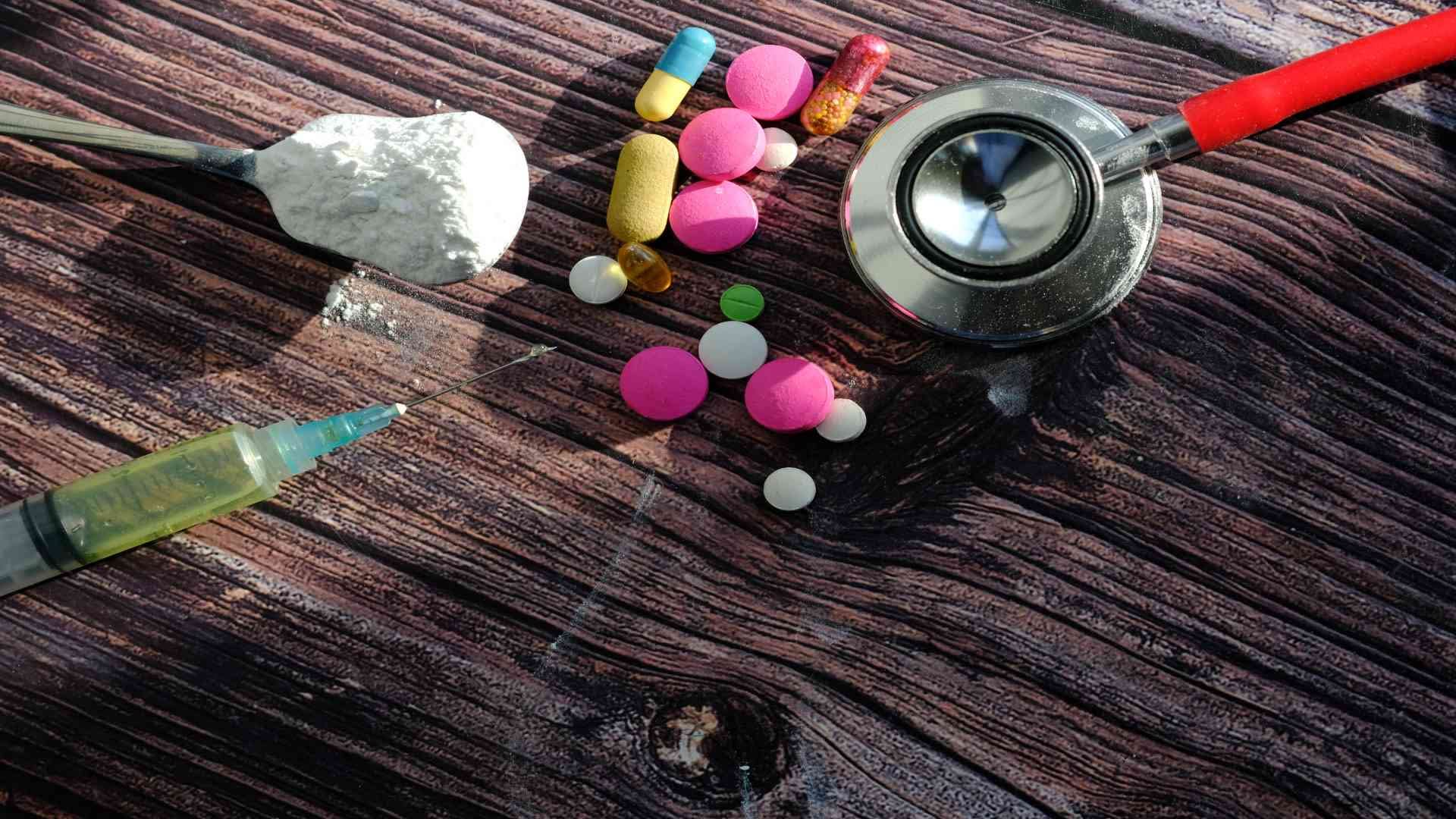 drug-syringe-and-cooked-heroin-on-spoon-top-view-2024-12-13-14-11-30-utc