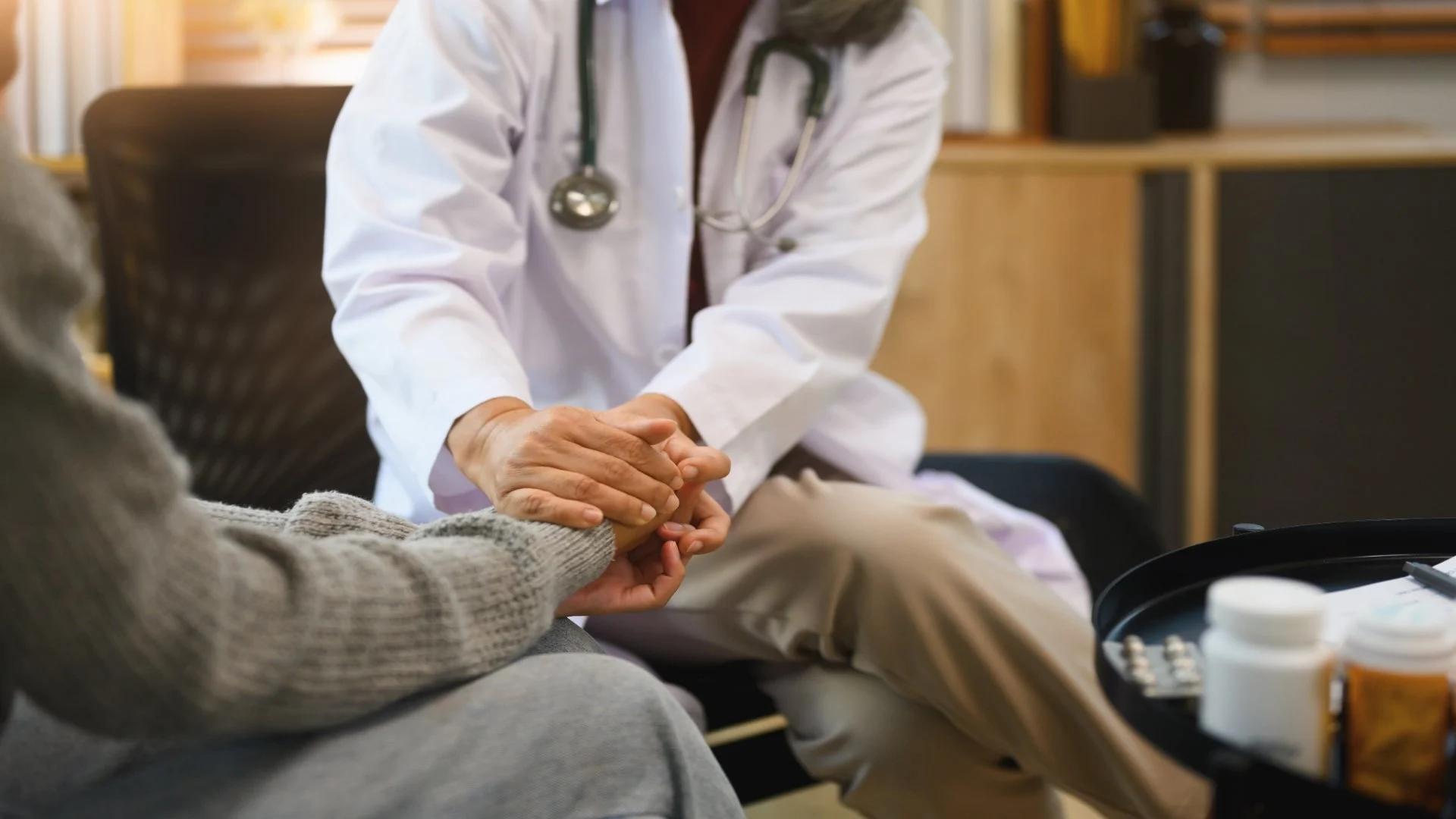 psychiatrist-gently-holding-patient-hands-support-2024-12-05-21-17-53-utc