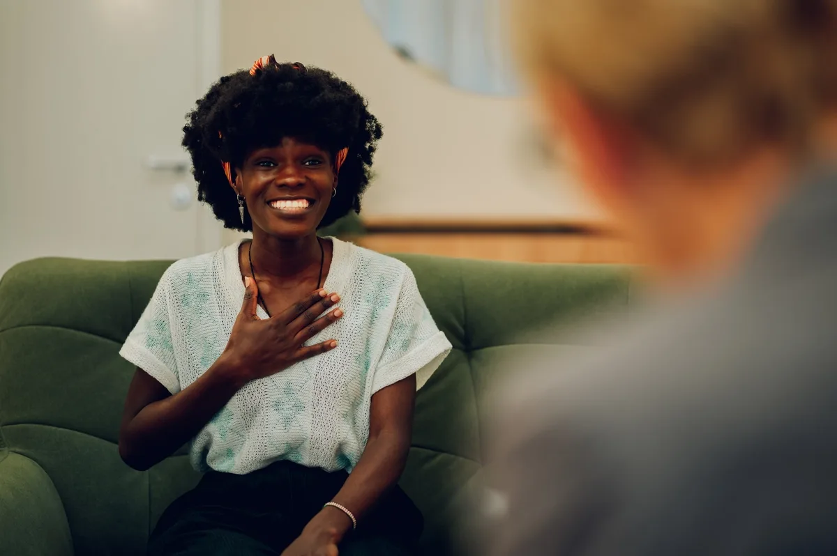 Individual Therapy: Woman smiling during individual therapy Individual Therapy: Woman smiling during individual therapy