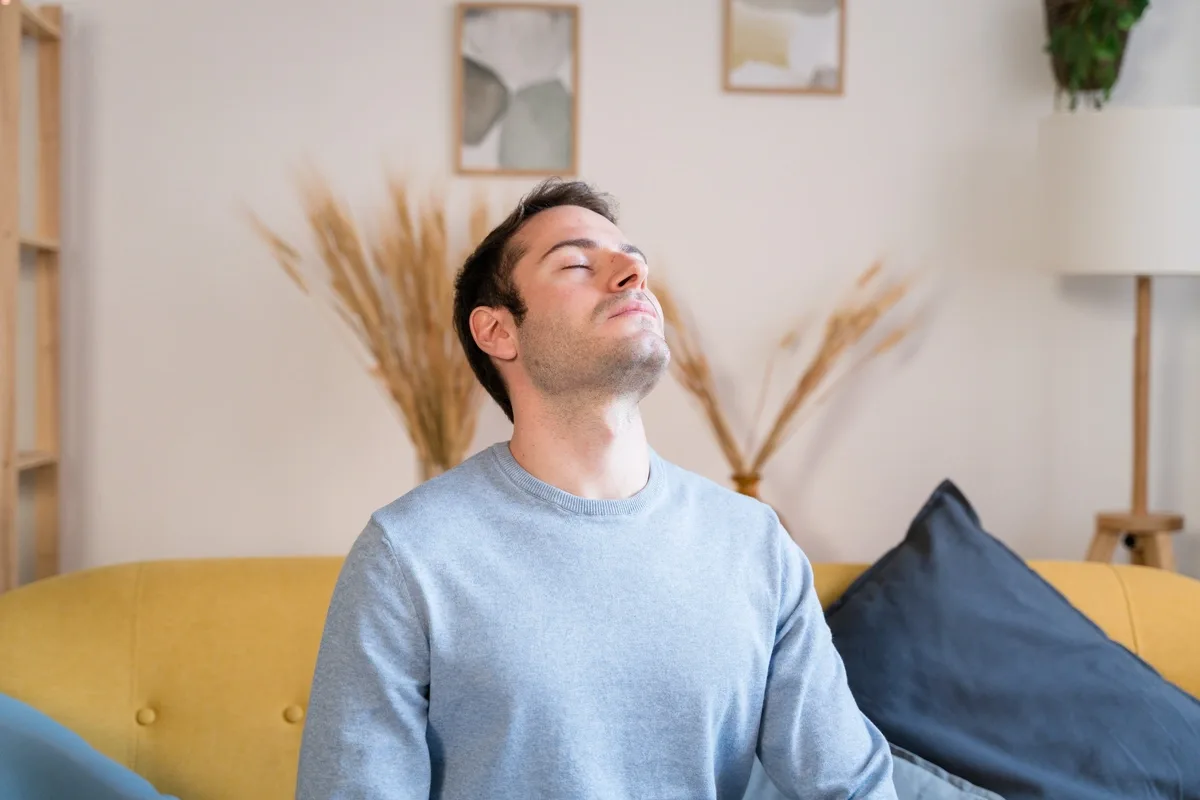 DBT: Exhausted man sitting on couch