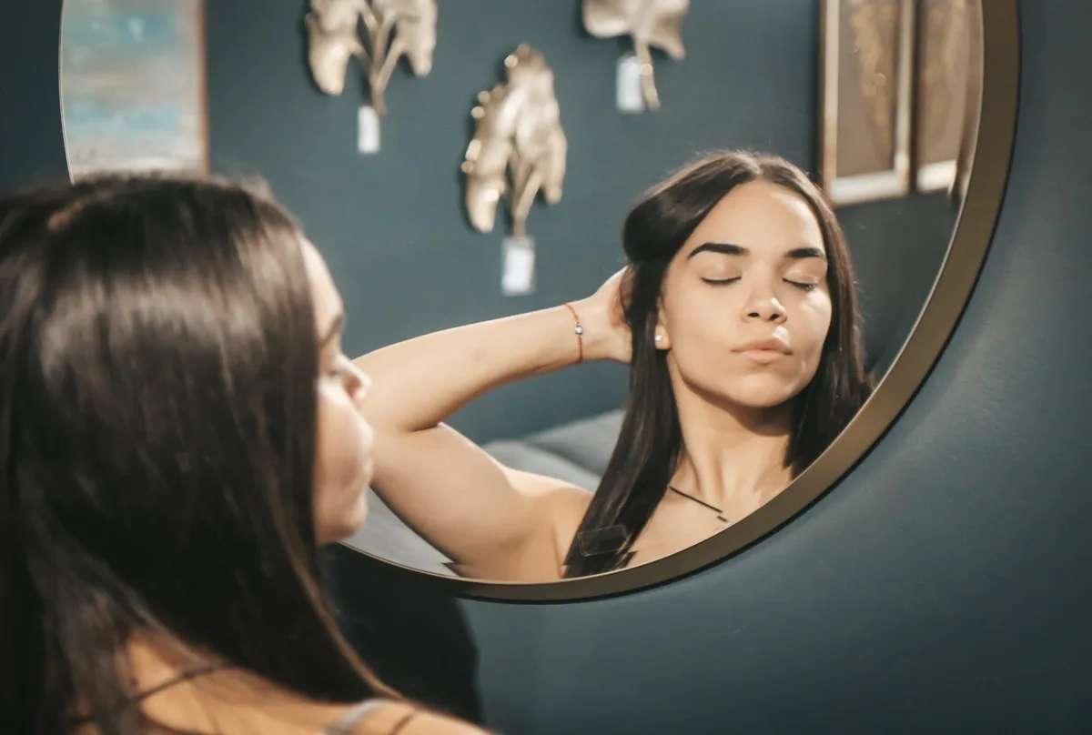 Woman basking in her image in the mirror