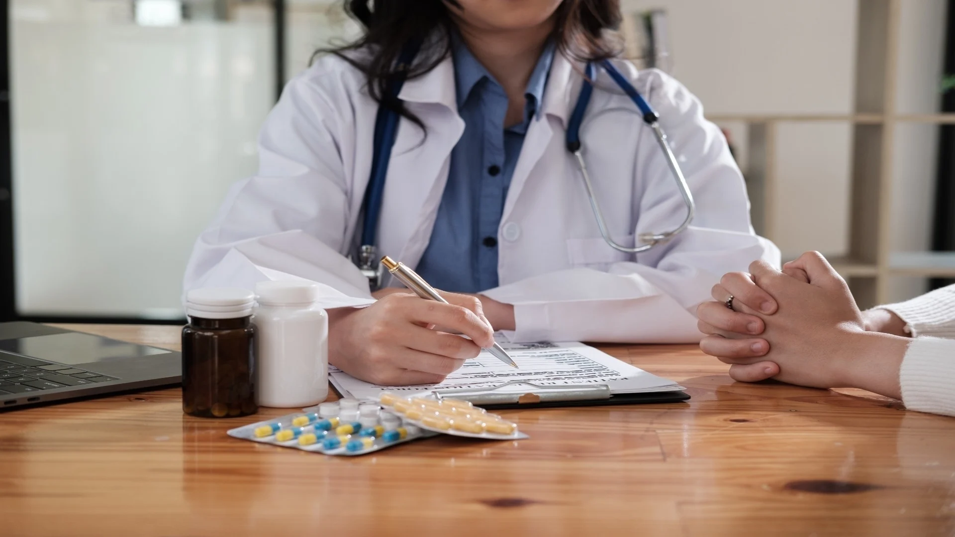 doctor-and-patient-discussing-something-while-sitt-2025-01-10-12-40-02-utc