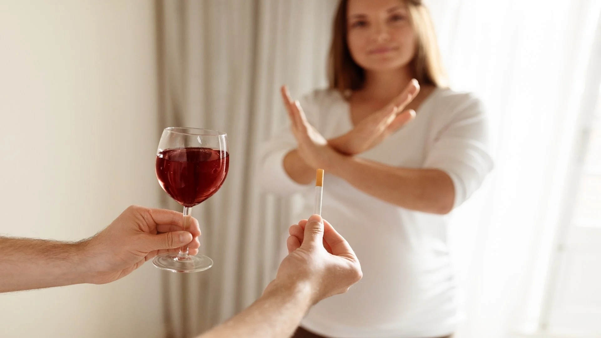 woman-declines-a-glass-of-wine-while-holding-a-tes-2025-03-18-18-23-02-utc