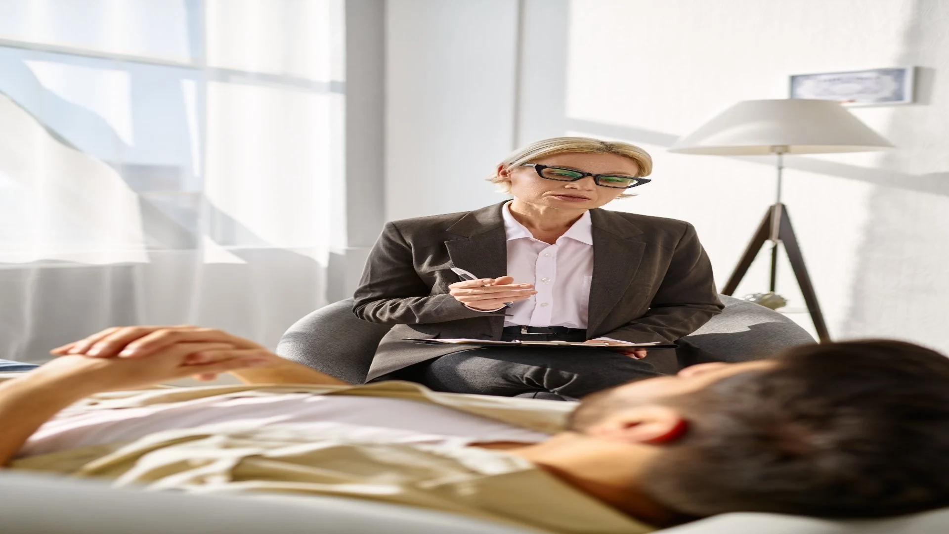 female-psychologist-working-with-man-on-couch-2024-12-04-15-12-10-utc