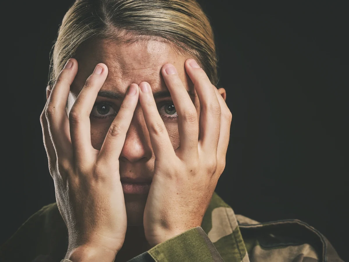 Soldier with PTSD Hiding Her Face Soldier with PTSD Hiding Her Face