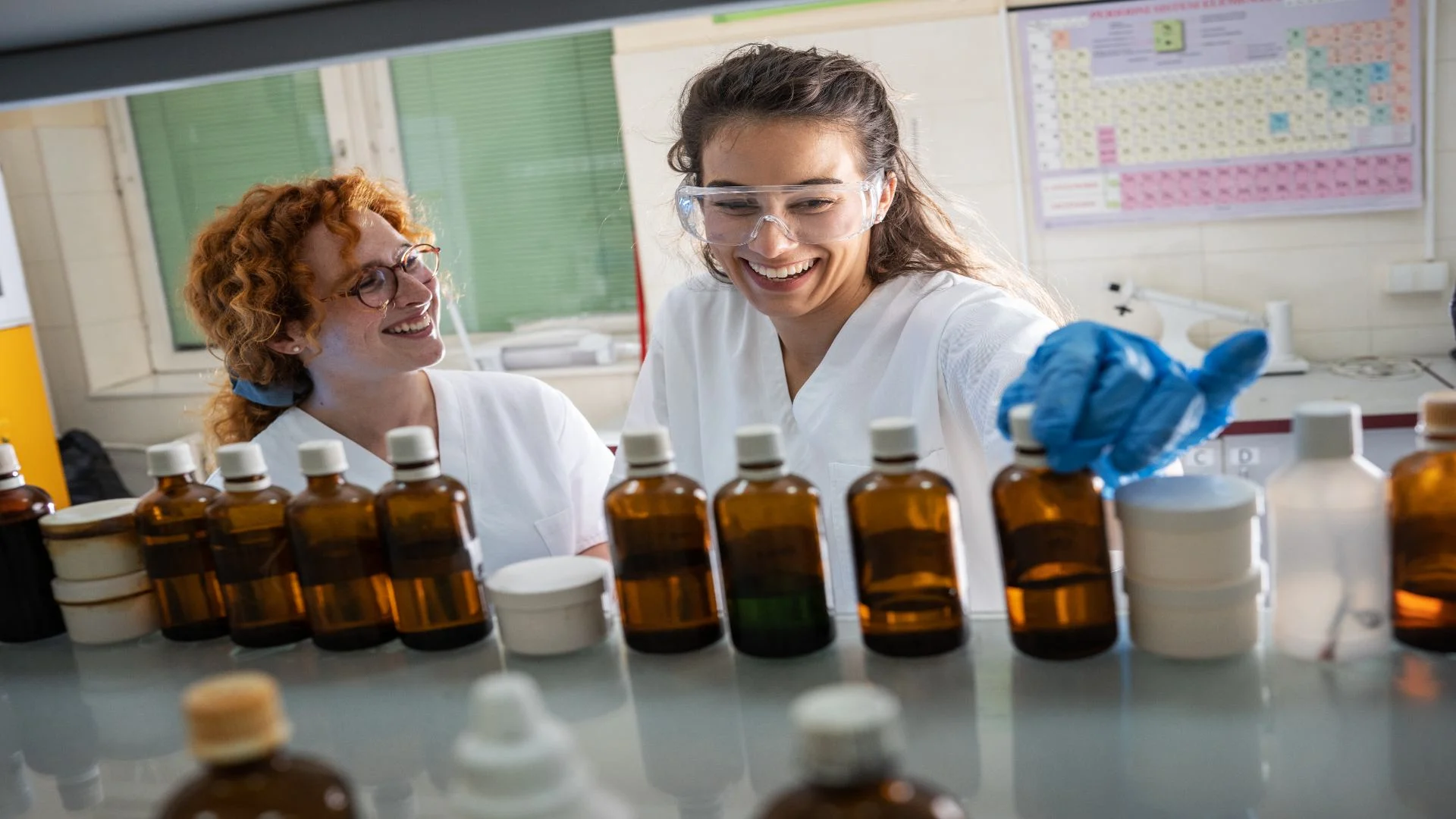 girls in chemistry lab manufacturing clonidine and bottling it.