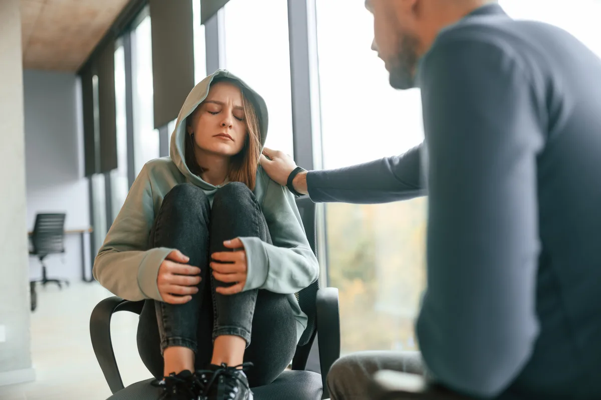 Meth Addiction: Man comforting woman experiencing meth withdrawal