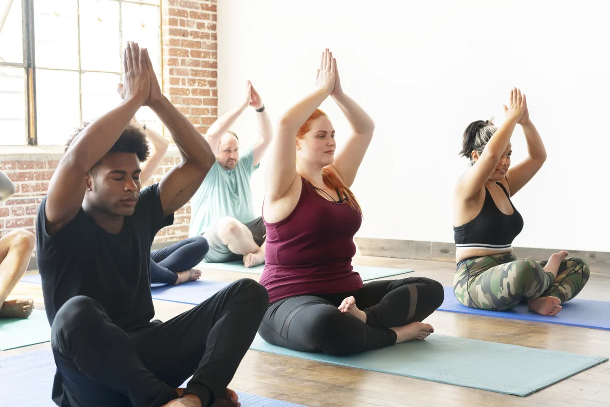 Experiential Therapy: People doing yoga indoors