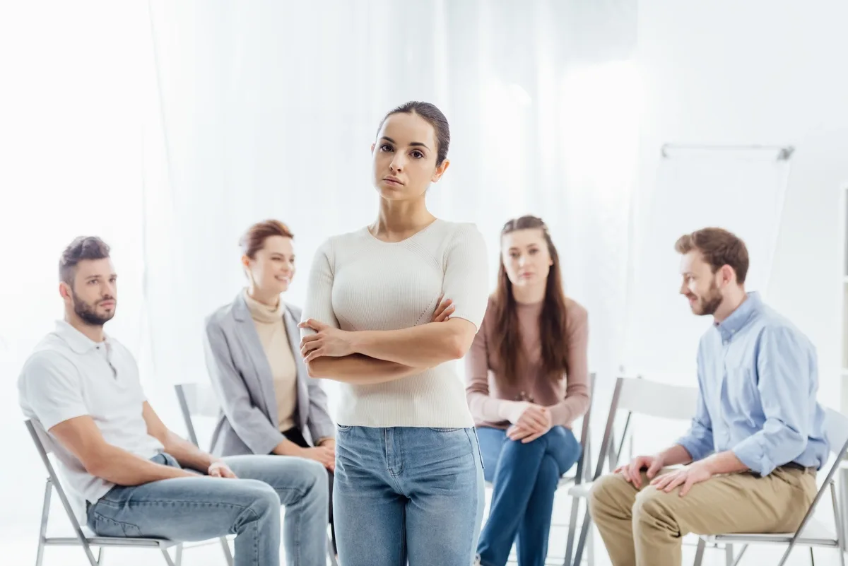 Defiant Woman Standing Challenging Staring at the Camera