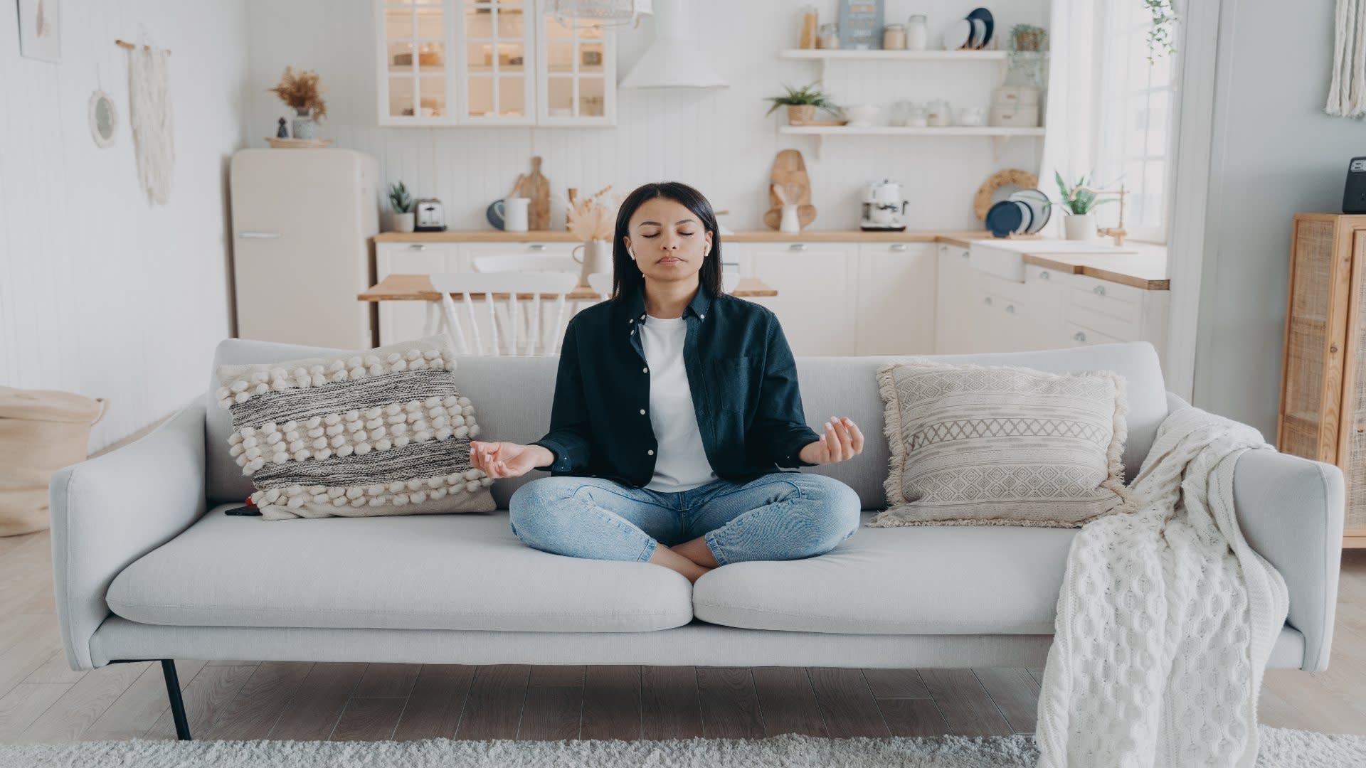 female-practice-yoga-relax-sitting-on-sofa-in-lo-2025-03-09-01-18-27-utc