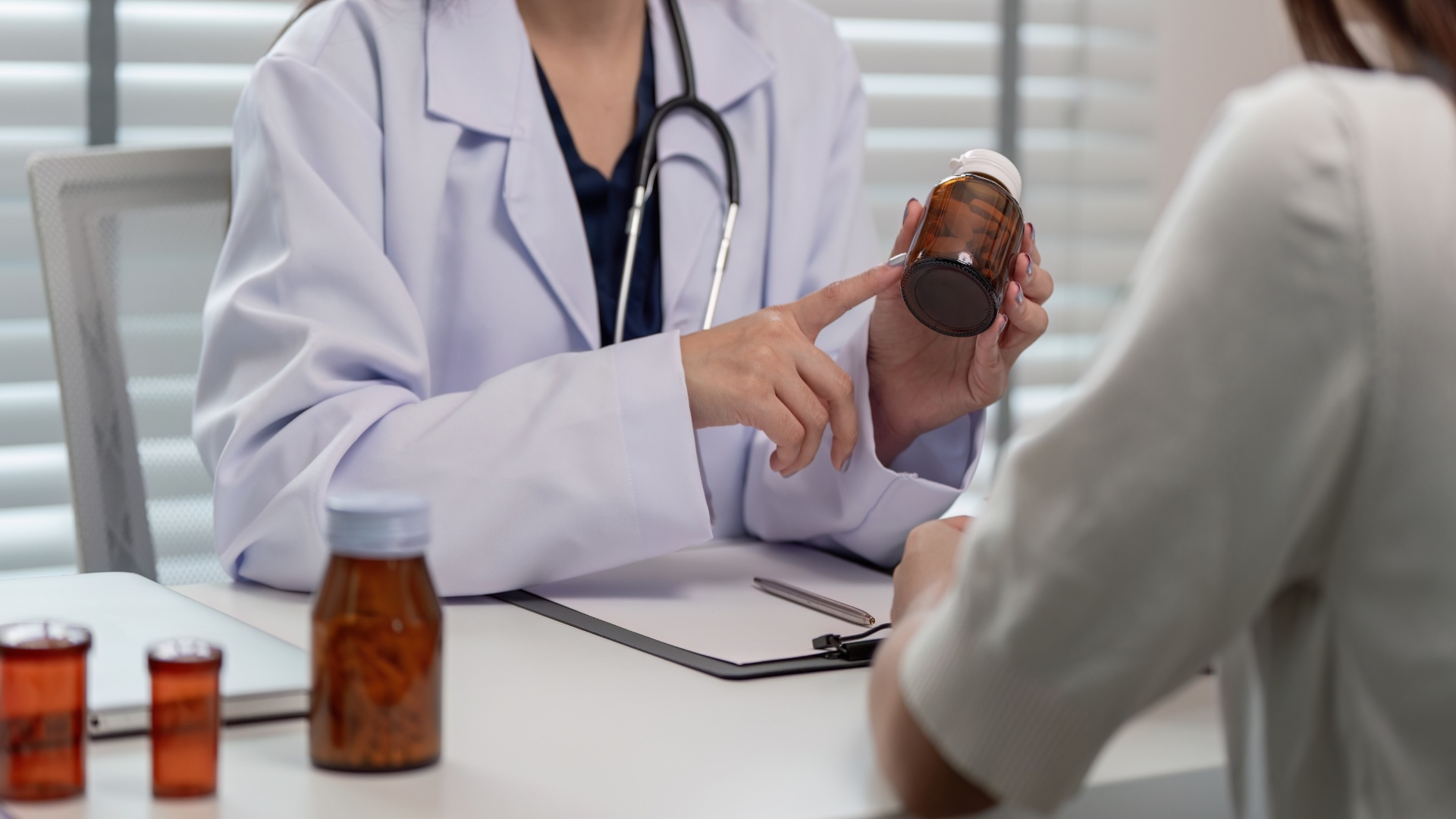 doctor-consulting-patient-and-prescribing-medicati-2025-01-10-12-50-23-utc