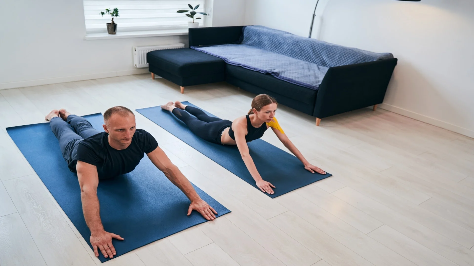 young-lady-and-neat-man-practicing-cobra-push-up-y-2025-03-06-22-31-04-utc