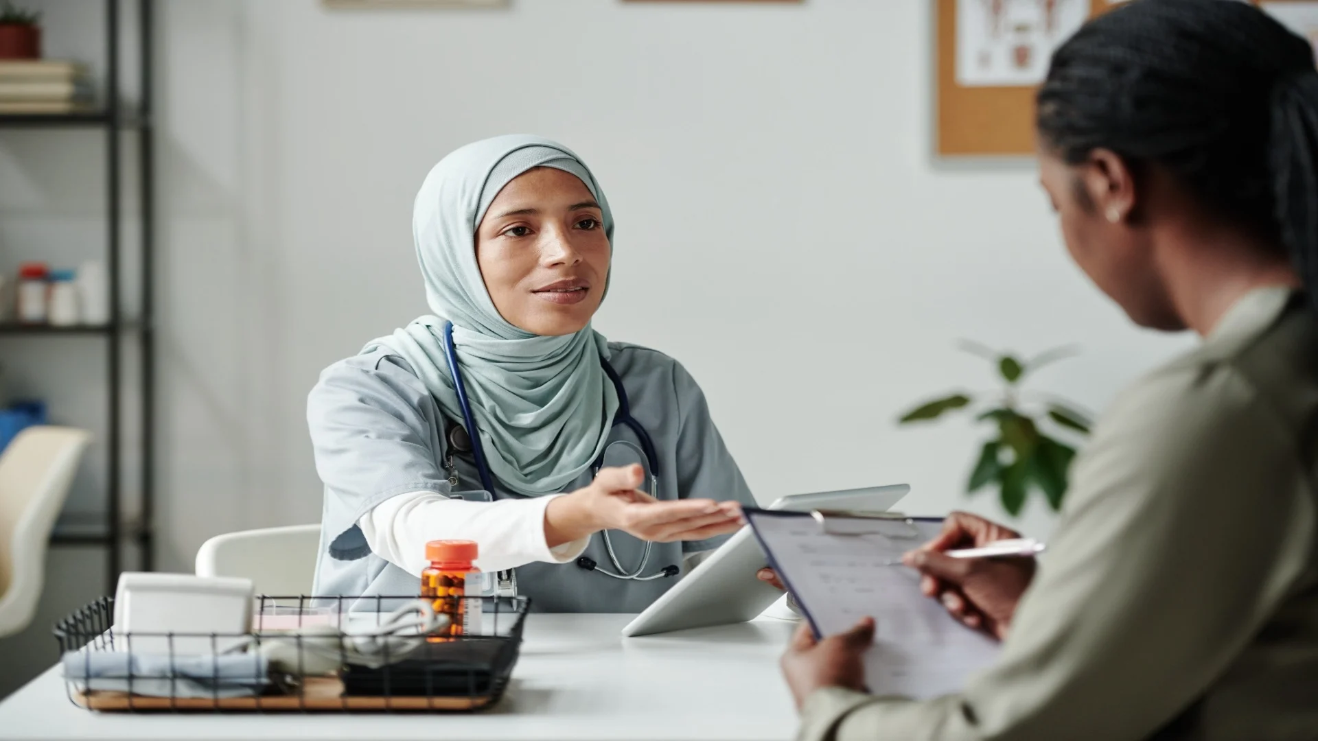 doctor-with-tablet-talking-to-patient-2025-03-16-01-49-01-utc