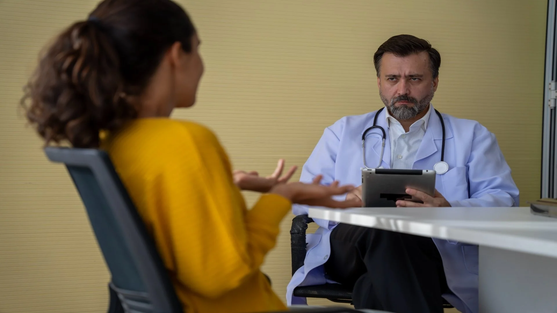 male-doctor-and-female-patient-2025-03-13-11-21-26-utc