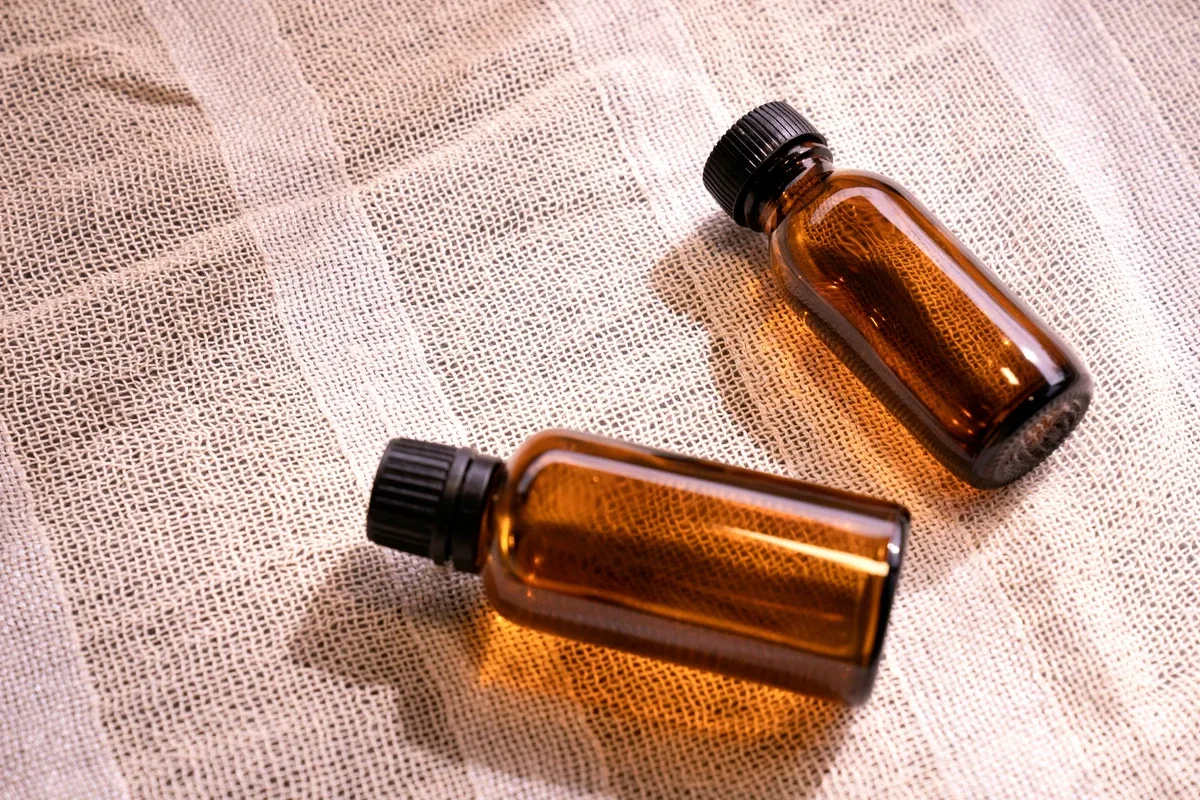 Inhalant Addiction: Two vials of liquid sitting on a blanket Inhalant Addiction: Two vials of liquid sitting on a blanket
