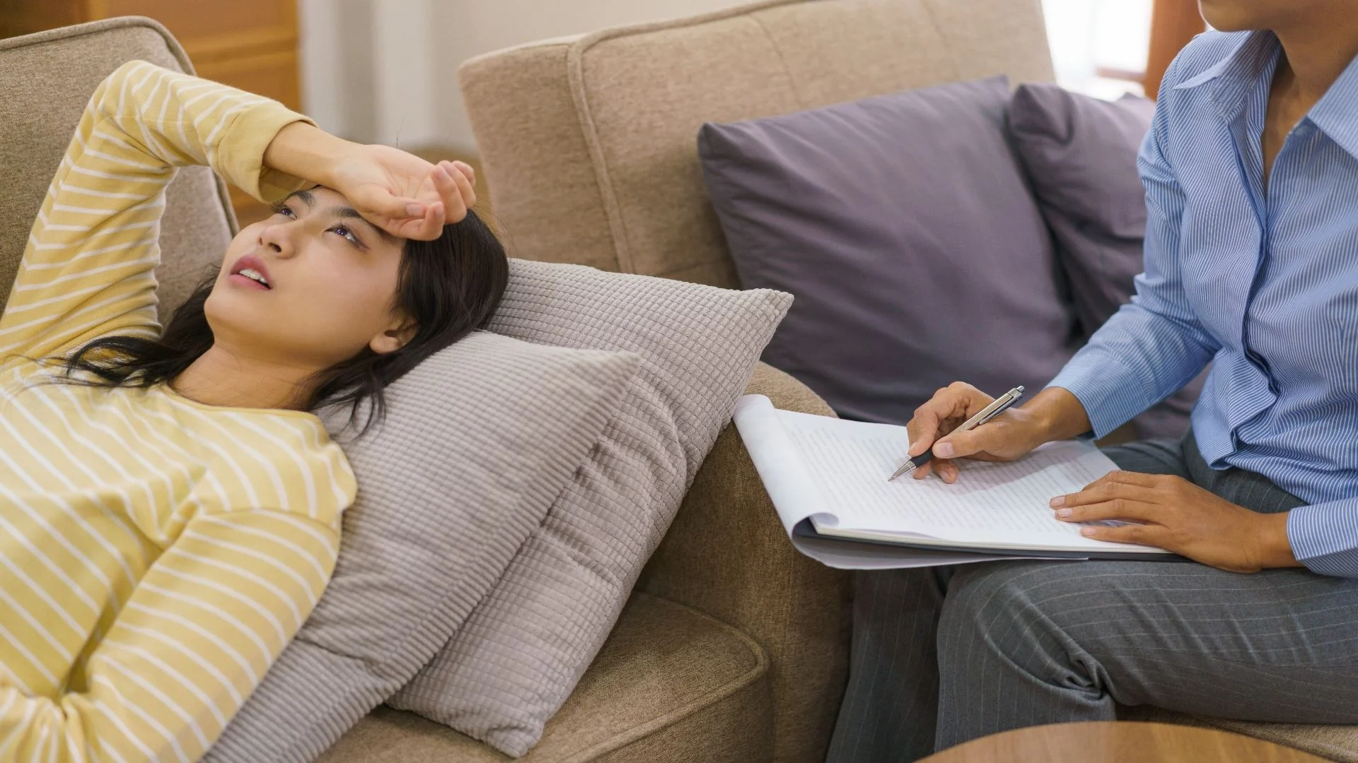 female-patients-lying-on-couch-and-having-session-2025-03-09-06-04-02-utc