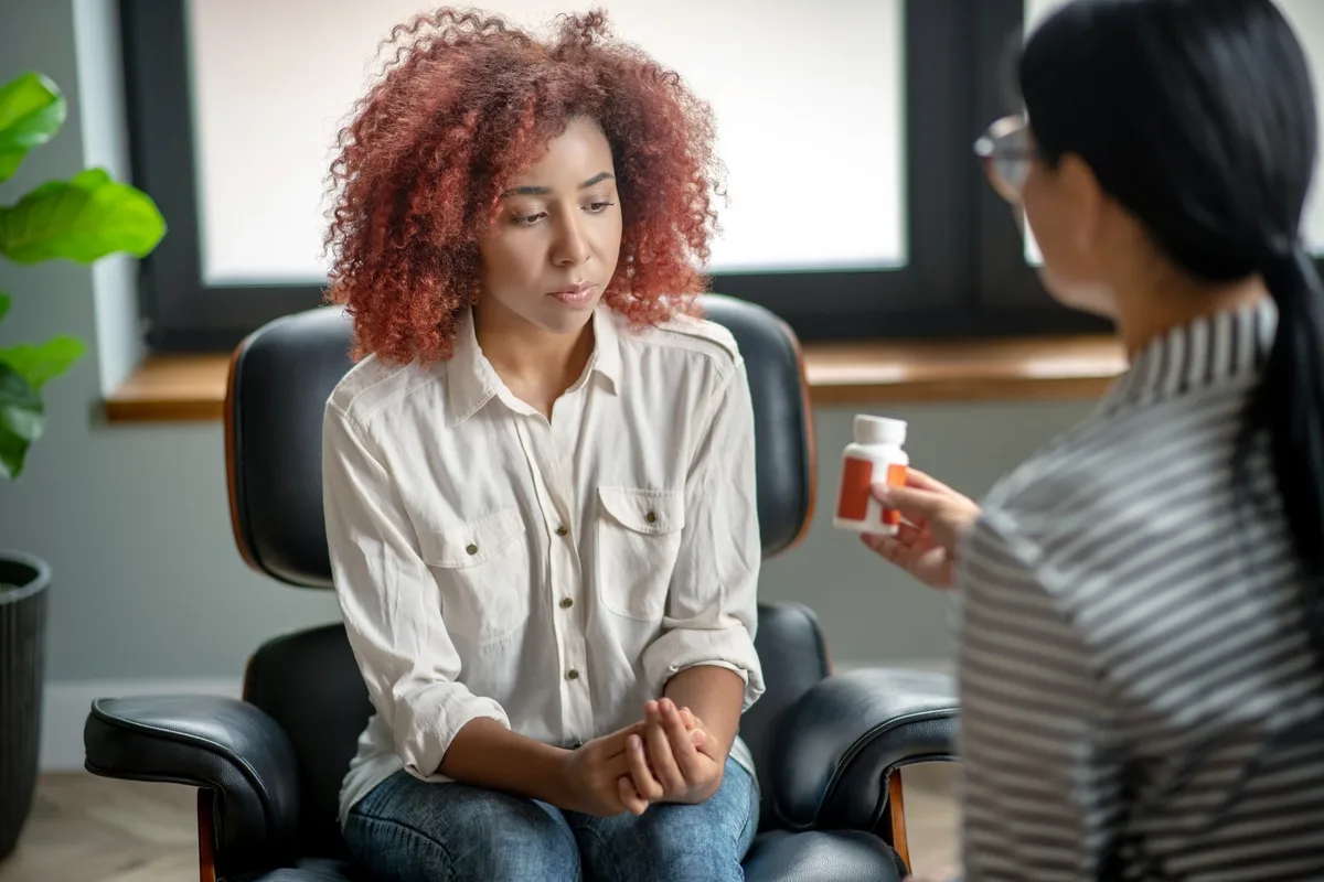 Opioid Addiction: Woman speaking with her doctor