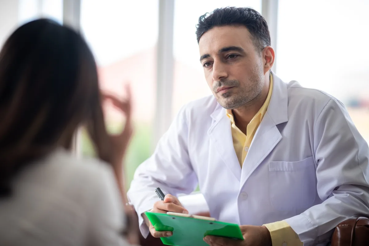 Synthetic Drug Addiction: Doctor listening to a patient