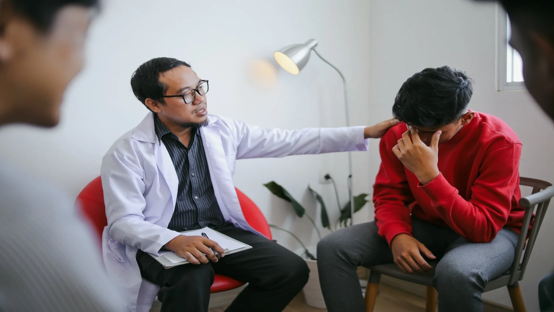 portrait-of-therapist-helping-crying-patient-in-me-2025-05-15-12-31-11-utc