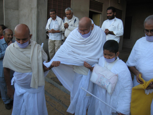 A group of men walking together in robes