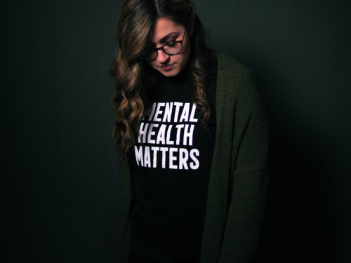 A person wearing a mental health matters t shirt
