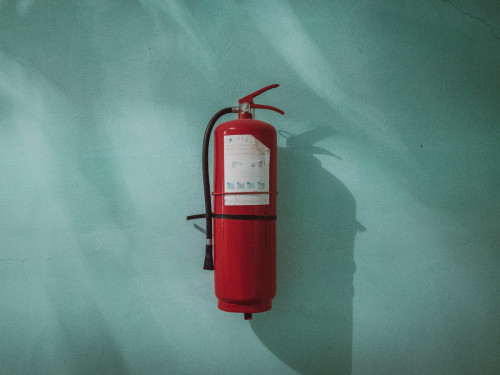 Fire extinguisher attached to wall