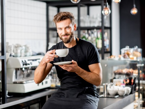 A person drinking a coffee