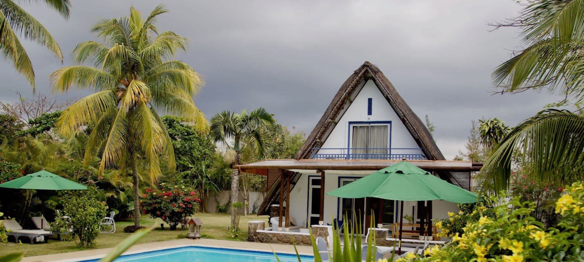 Family villa at Bluebird Mauritius guesthouse with pool and tropical garden in Pereybere