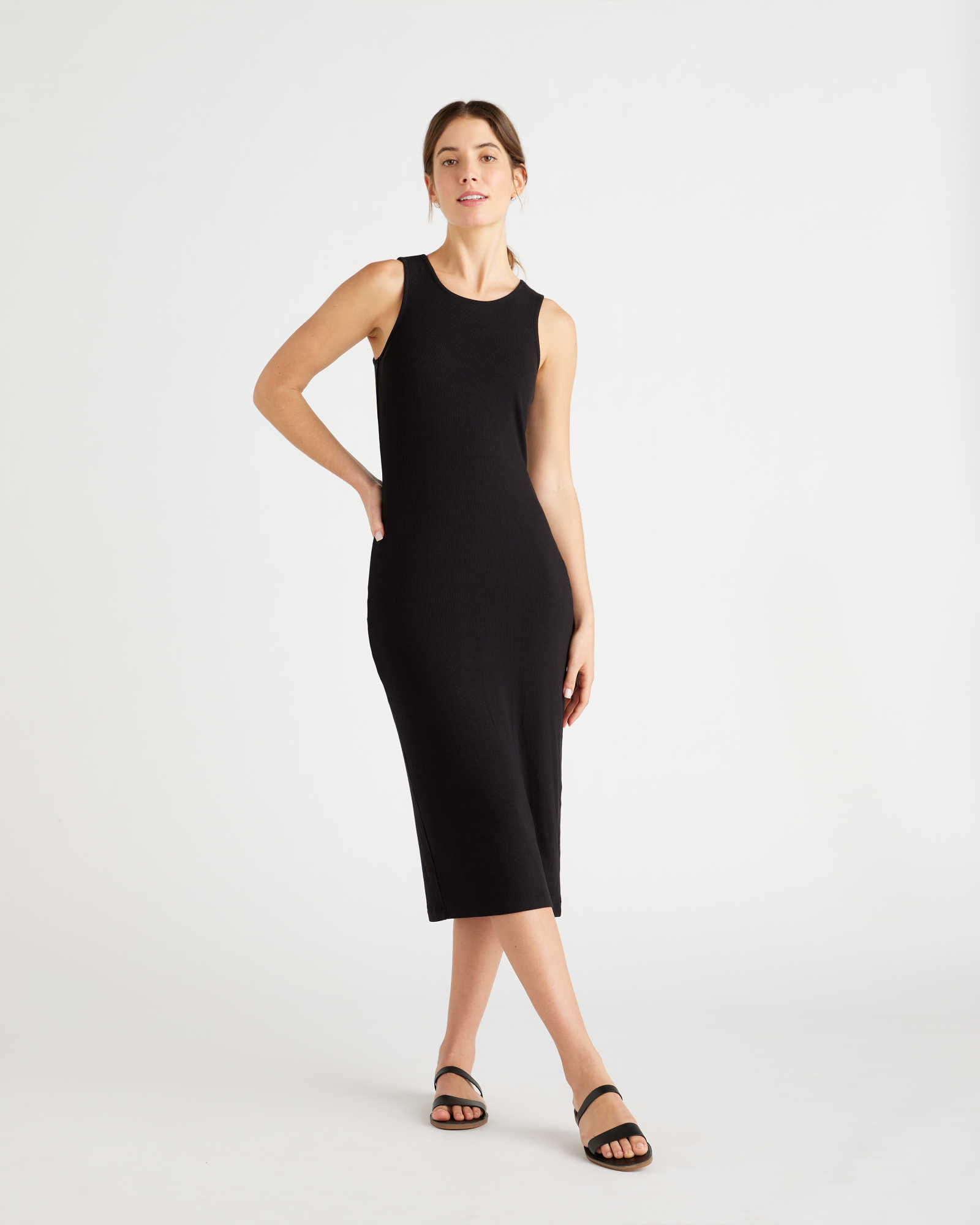 Woman wearing a rib knit dress in black from front