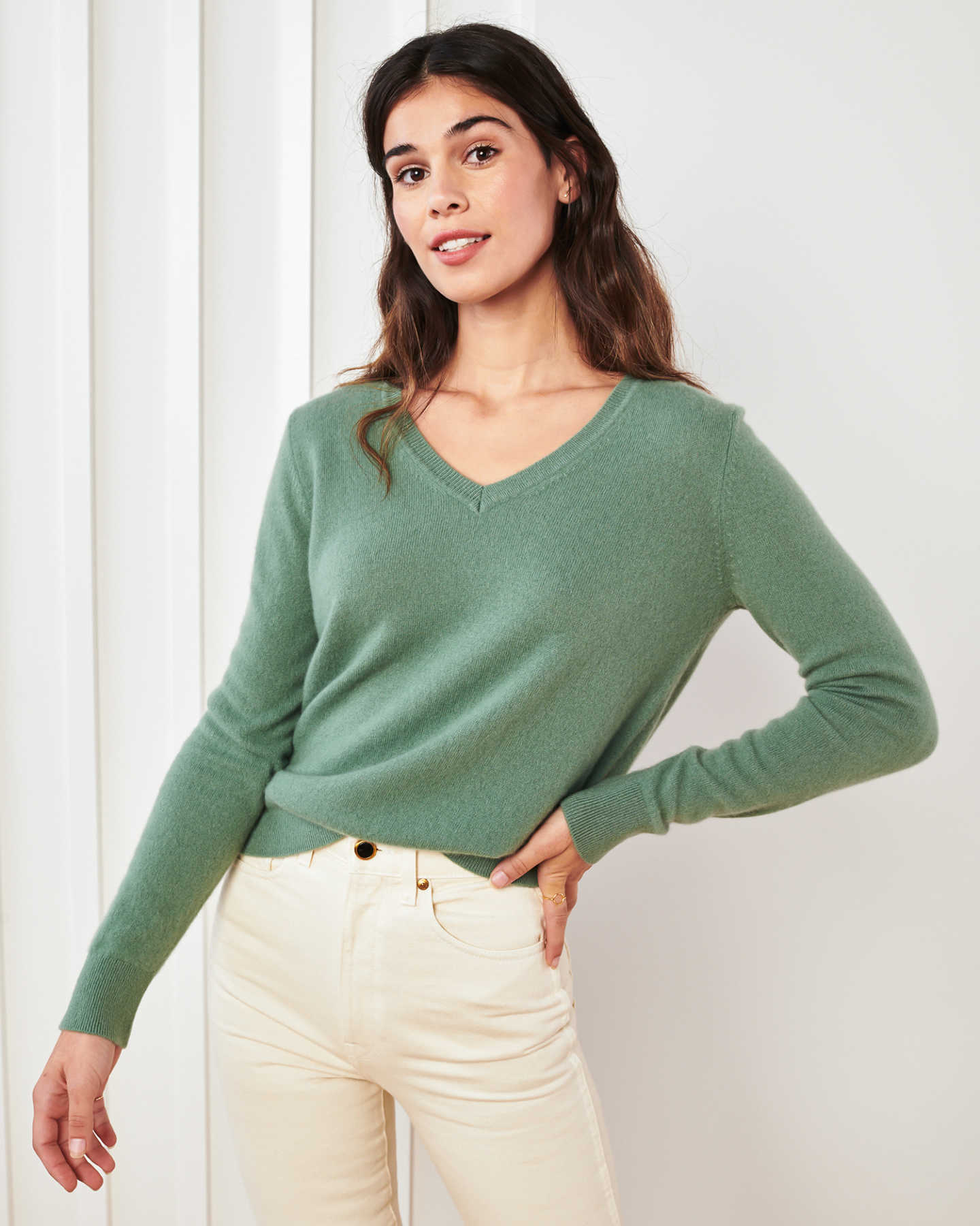 green cashmere v-neck sweater women leaning