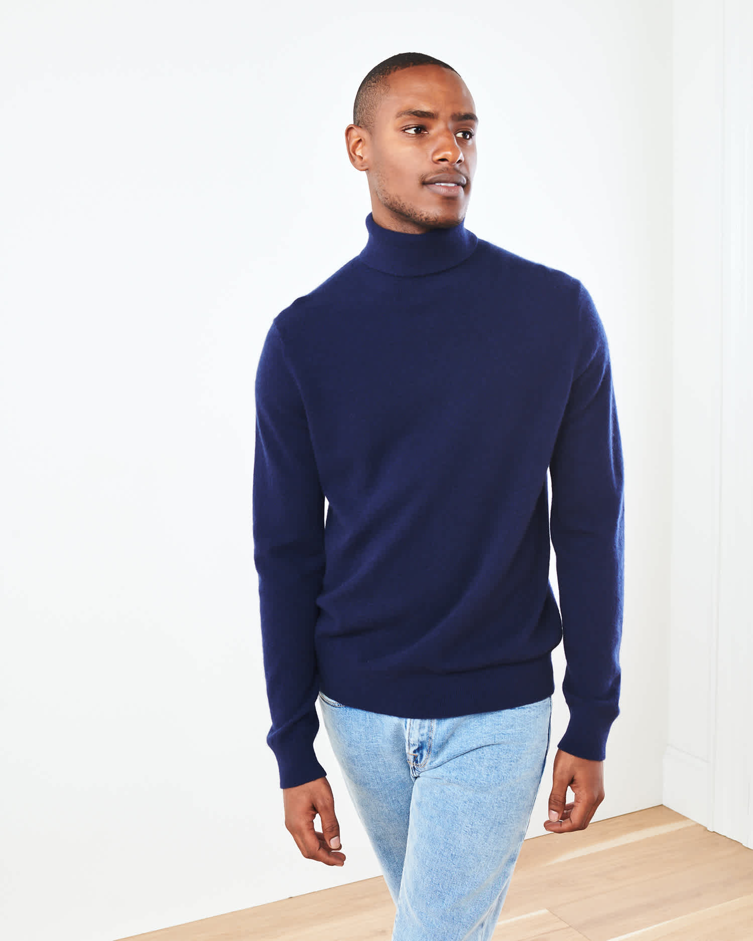 Man wearing navy men's cashmere turtleneck sweater