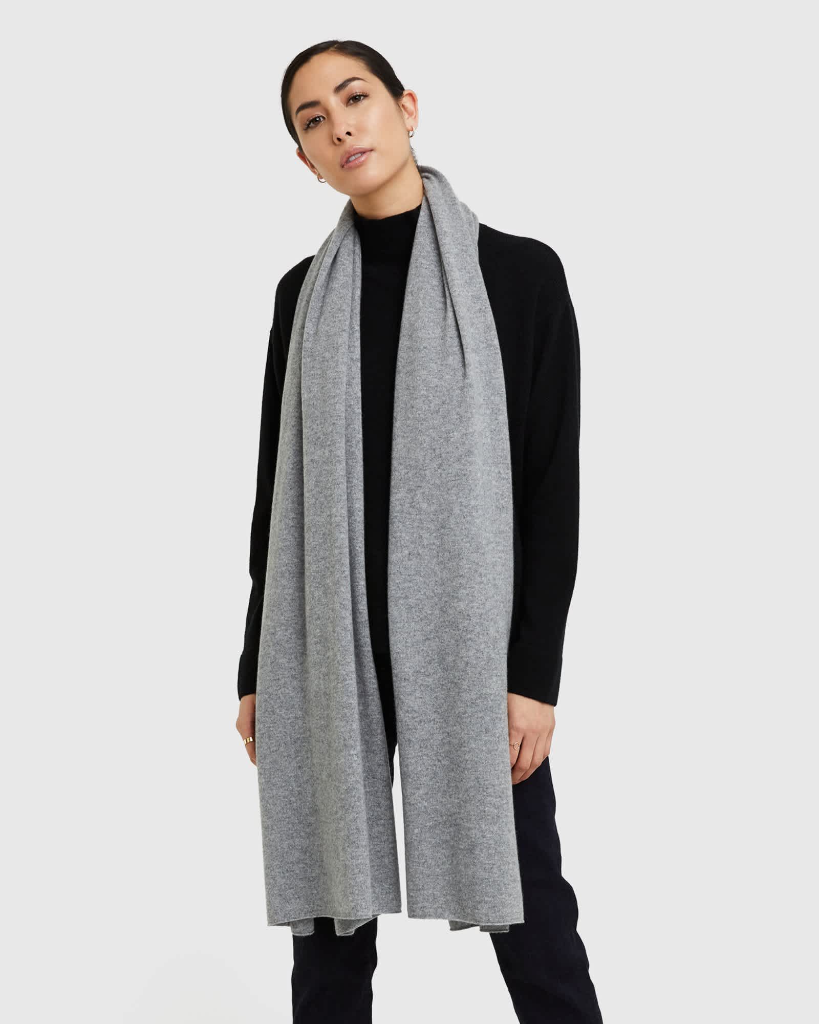 Woman wearing grey cashmere wrap & cashmere shawl wrap with black cashmere sweater