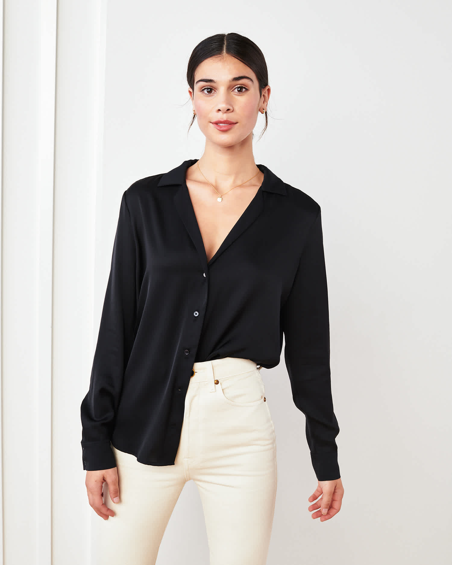 woman wearing silk notch collar blouse in black