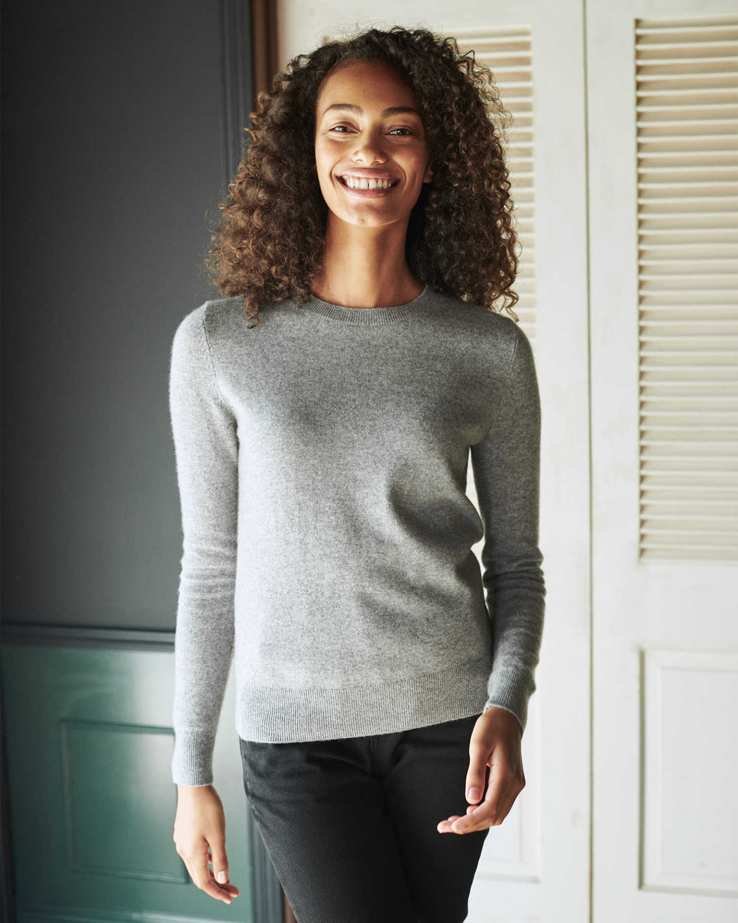 woman wearing grey womens cashmere sweater smiling