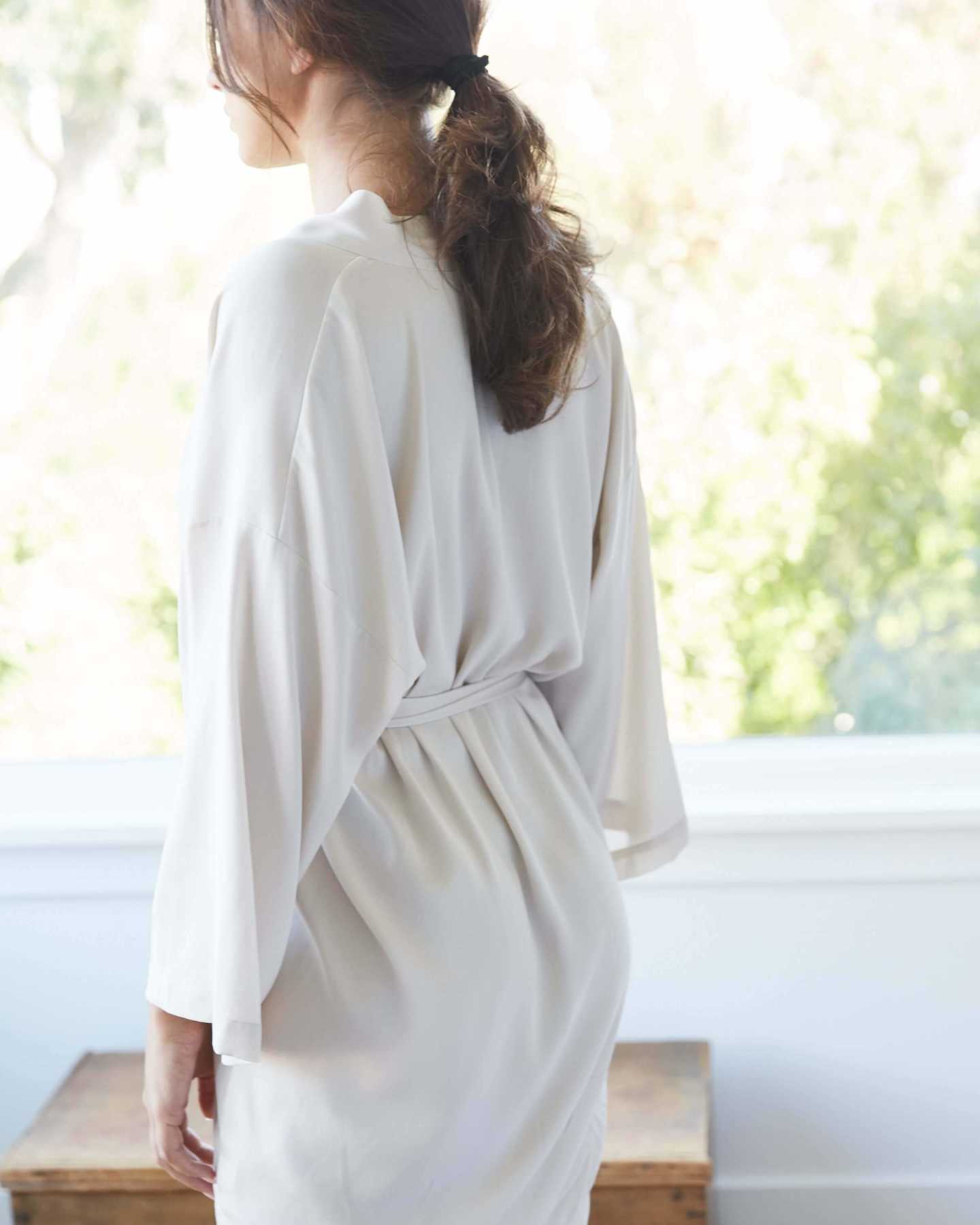 woman wearing silk robe from back