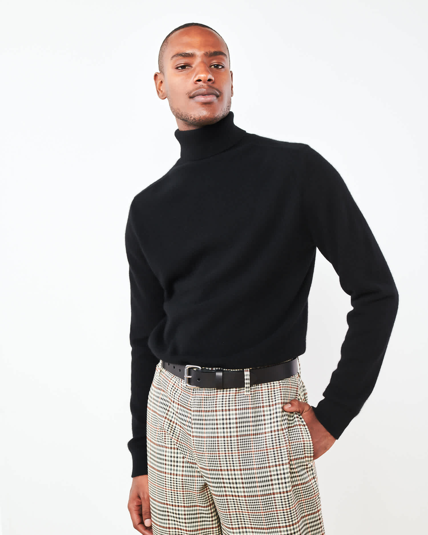 Man wearing men's black cashmere turtleneck sweater