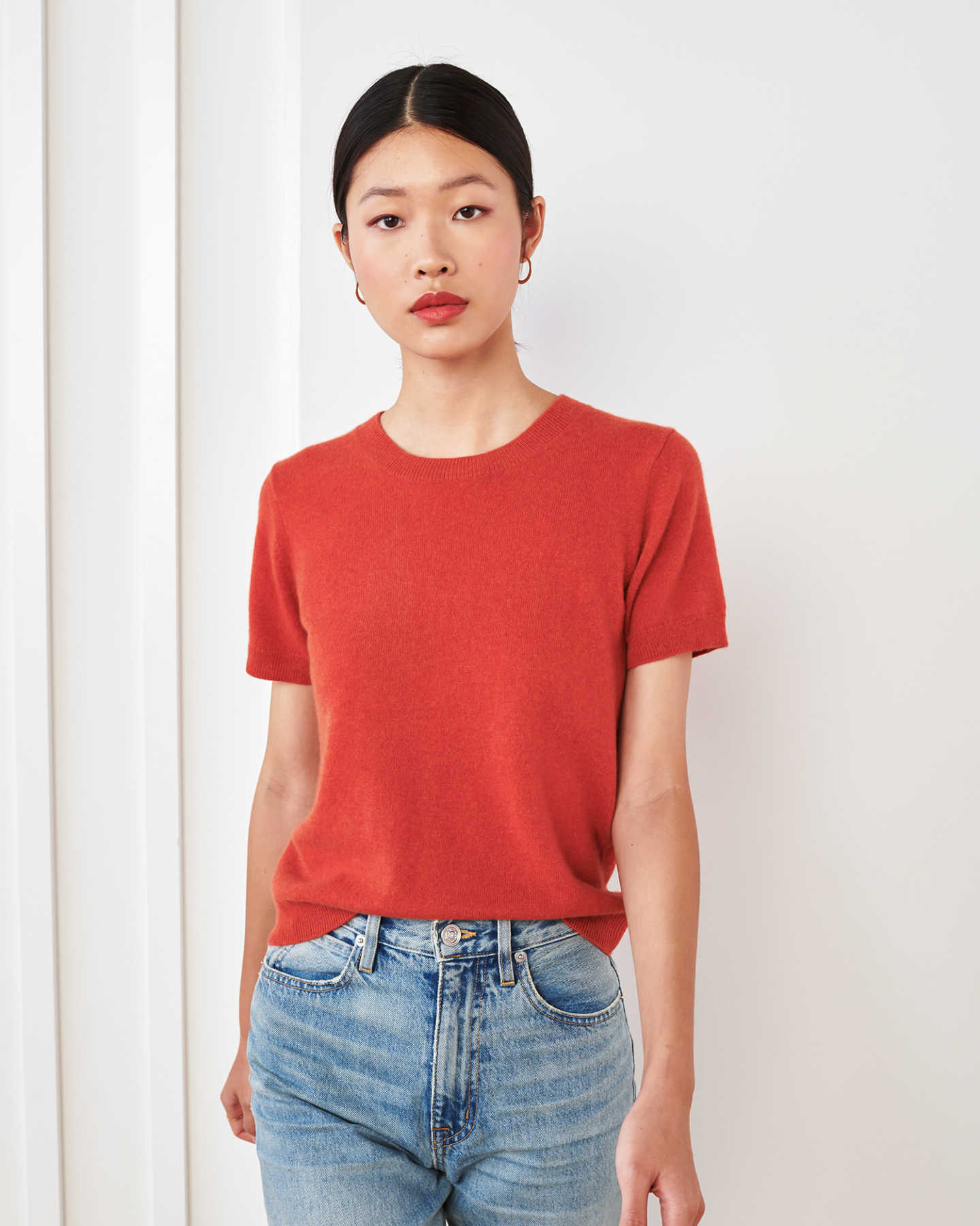 woman wearing red cashmere tee and short sleeve cashmere sweater 