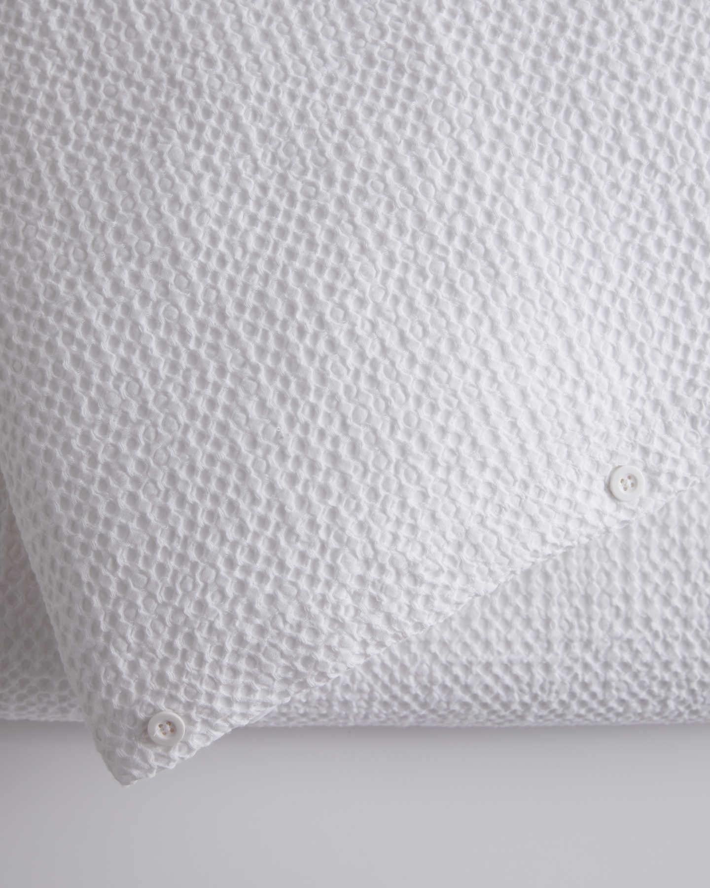 waffle duvet cover on bed zoomed in white color