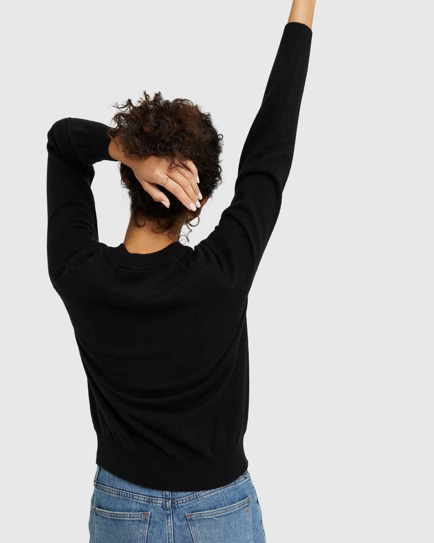 black cashmere sweatshirt for women arms raised